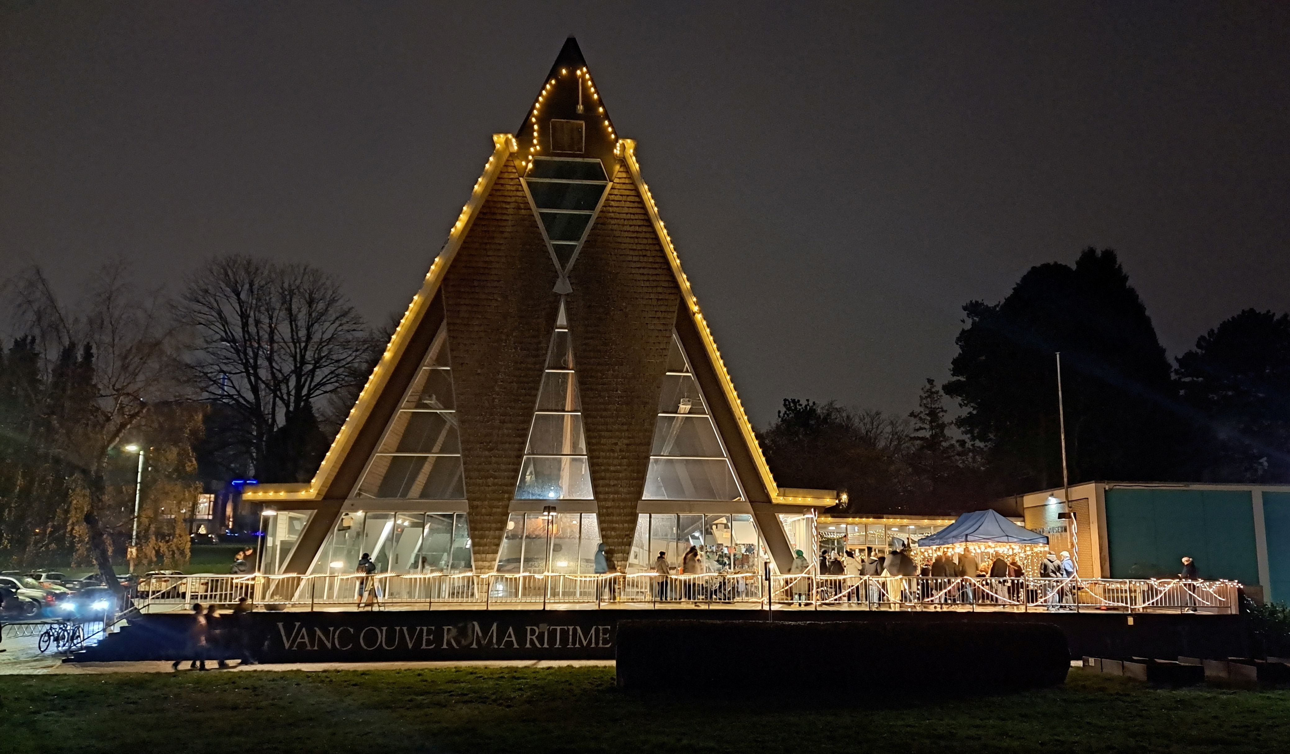 Vancouver Maritime Museum at night with decorative lights.
